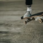 person jumping with skateboard