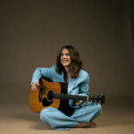 Charlotte Carpenter with guitar