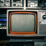 grey and orange CRT TV