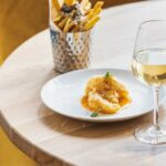 tempura prawns with a glass of white wine