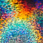 a close up of a multicolored object with a black background