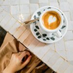 white and black ceramic cup with saucer