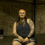 Michelle Manetti with brick wall behind