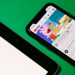 black android smartphone on green table