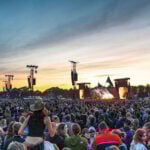 Roskilde Festival Crowds view of the stage at sunset