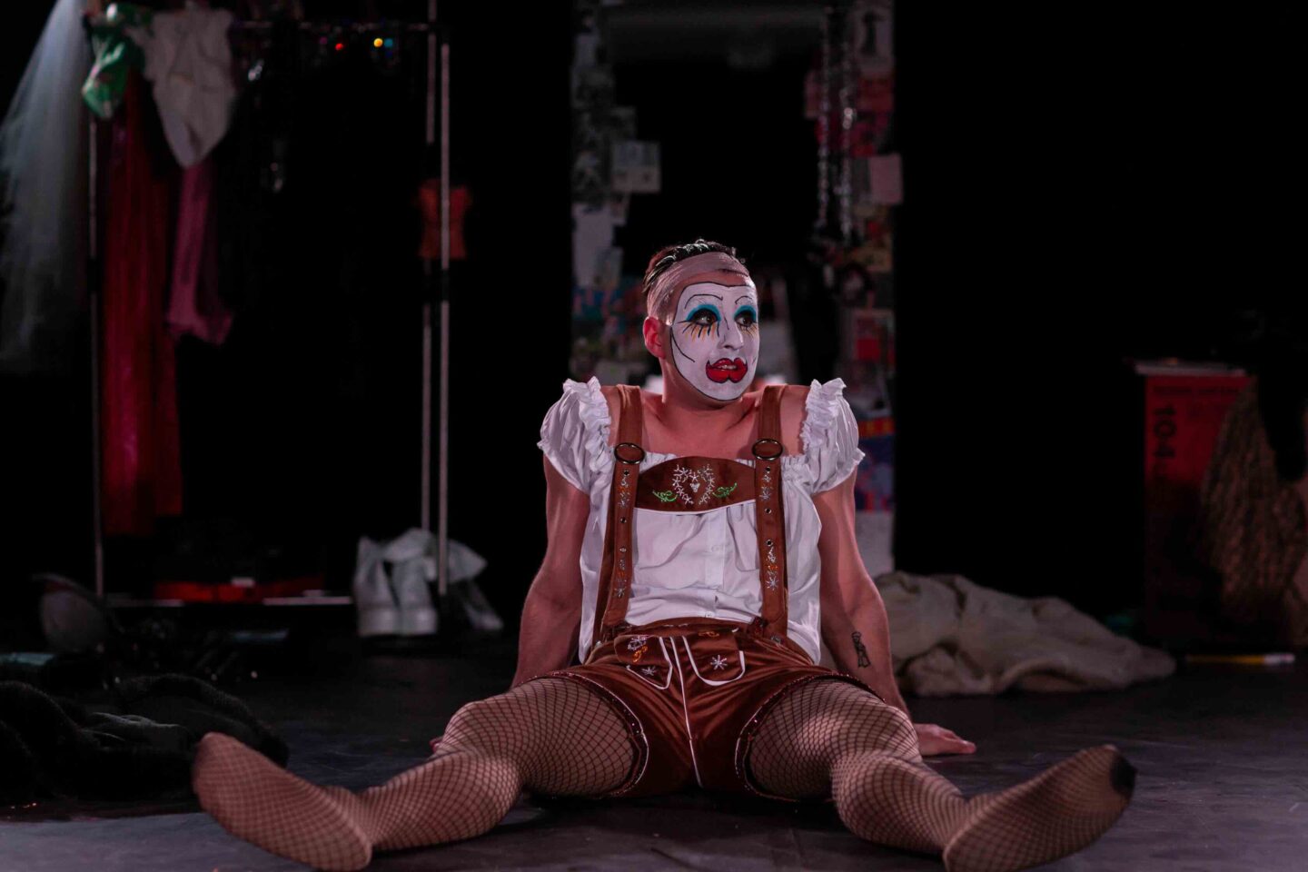 a clown sitting on the floor