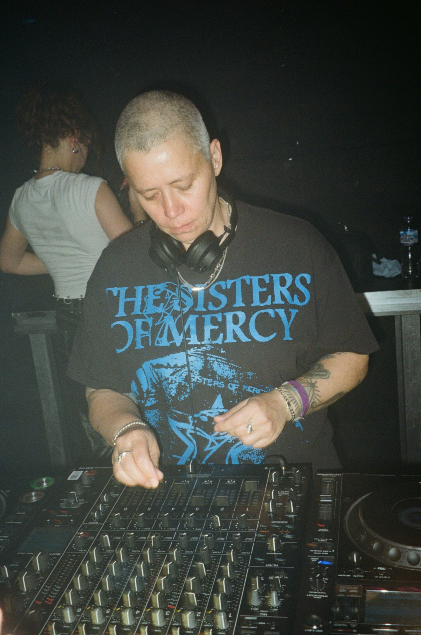 a person with headphones on dJing