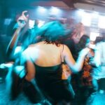 a group of people dancing at a party