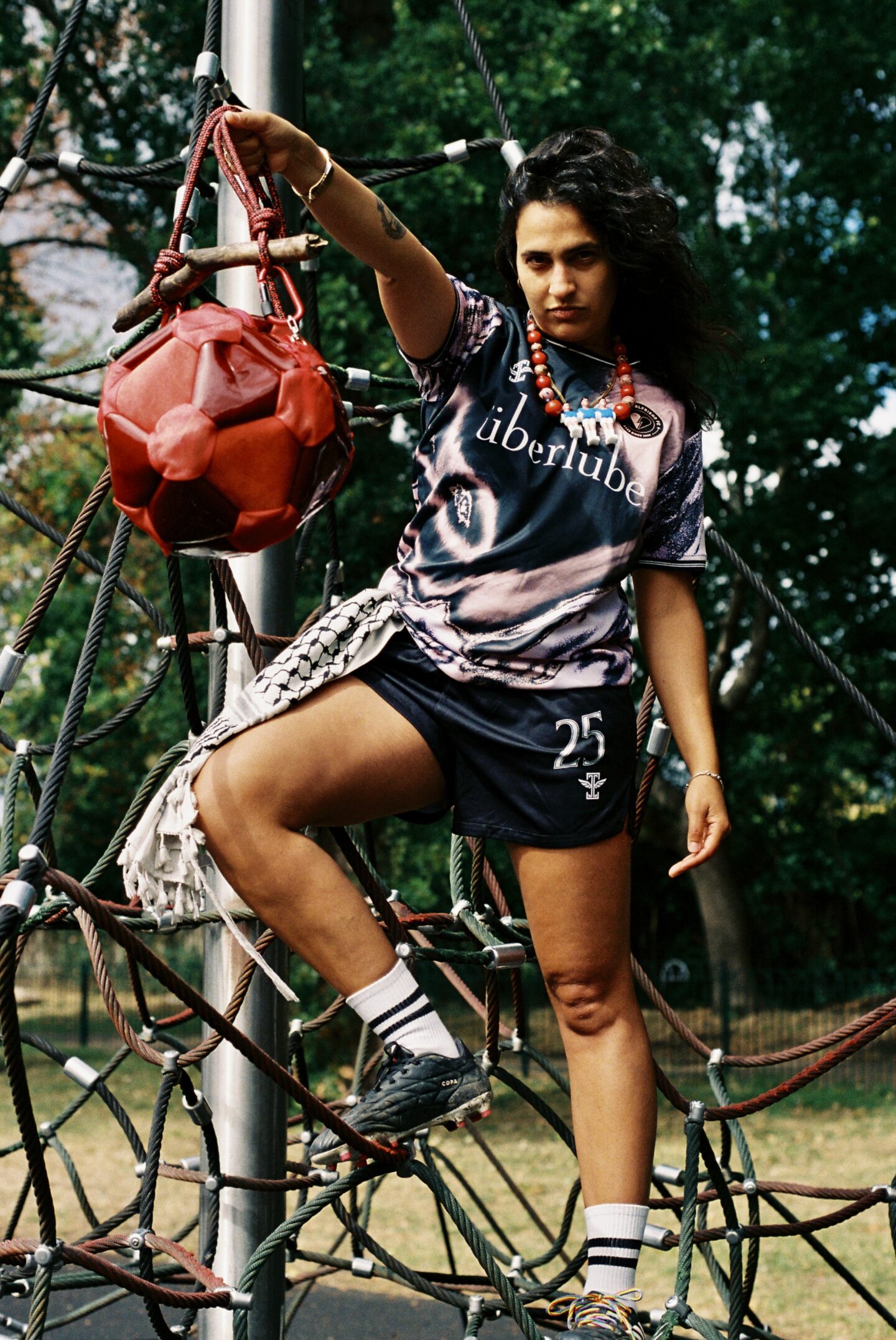 a person holding a football bag