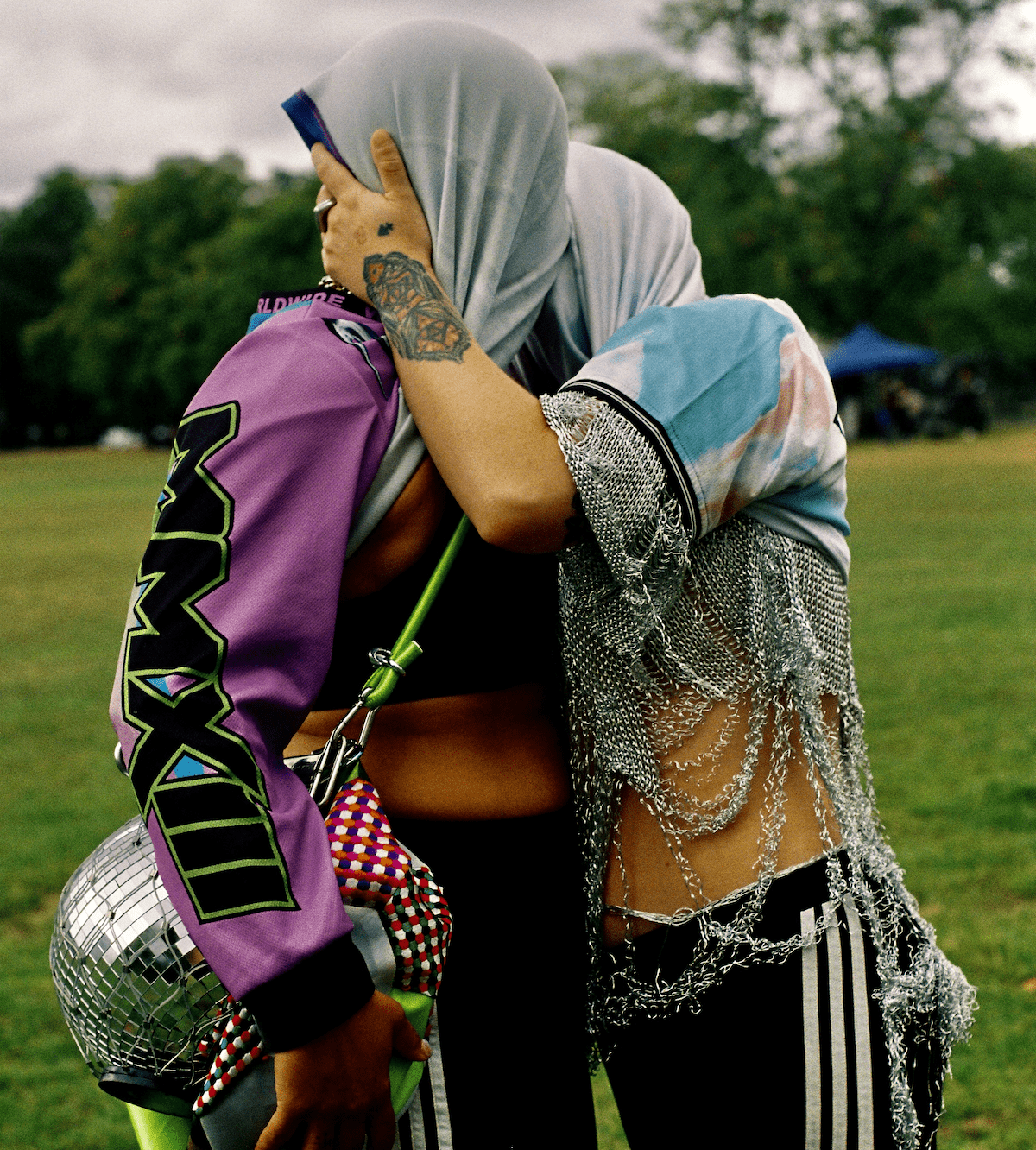 Two people kissing with t-shirts over their heads