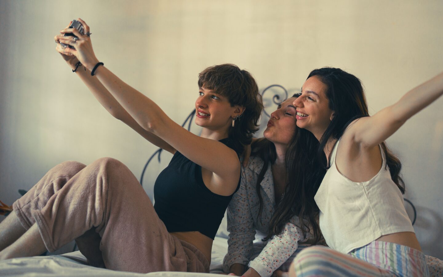 three people taking a selfie